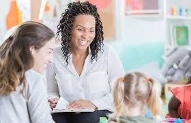 A female Teacher remarking her students